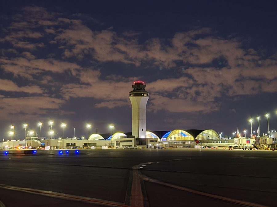 Photo of the exterior of an airport at night