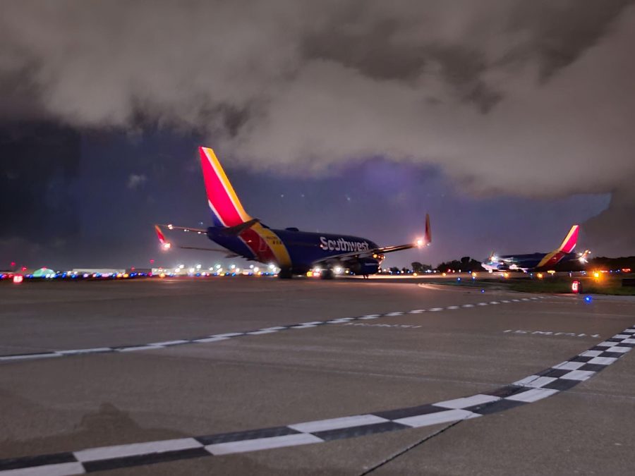 The back of a multicolored Southwest Airlines plane as it taxis on a runway