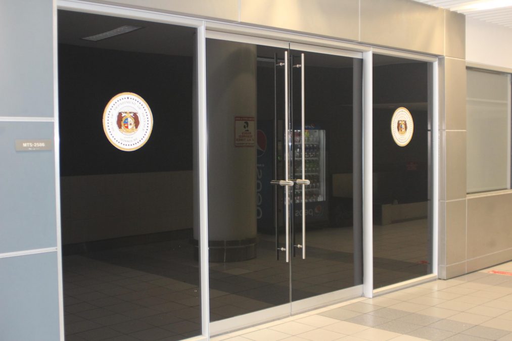Photo of black glass doors in a hallway