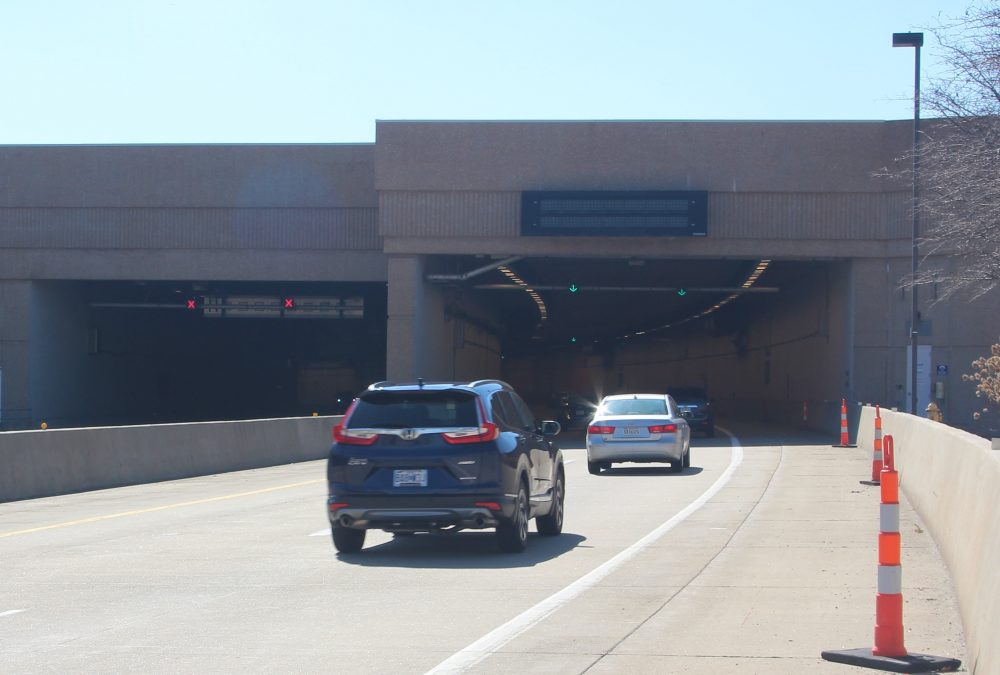 A photo of the exterior of a parking garage during the daytime