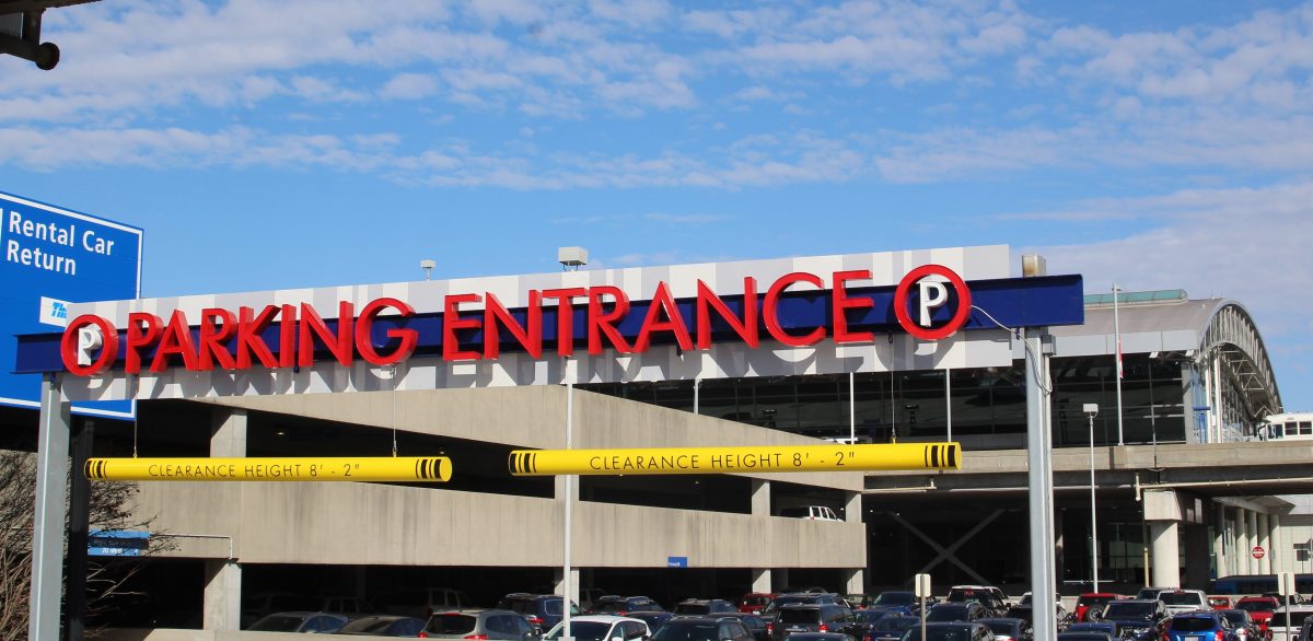 A photo of the entrance to a parking garage with large red letters