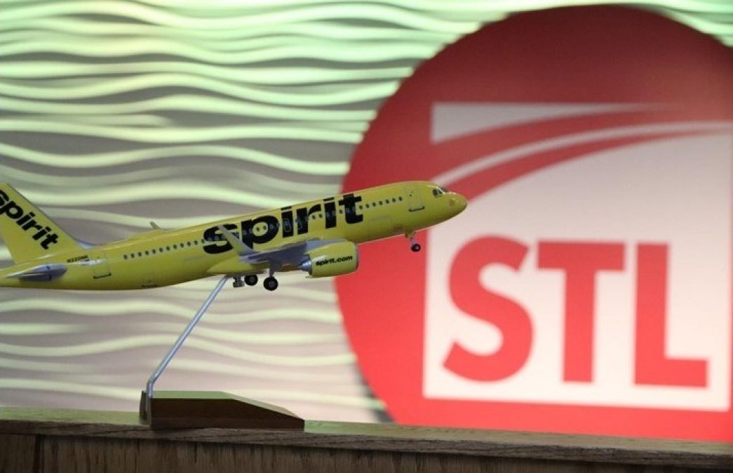 Photo of a Spirit Airlines diorama, with a bright yellow plane and black writing on the side