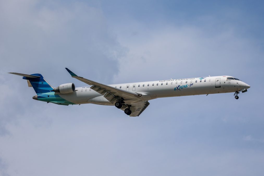 Photo of an Indonesian plane flying through a cloudy sky