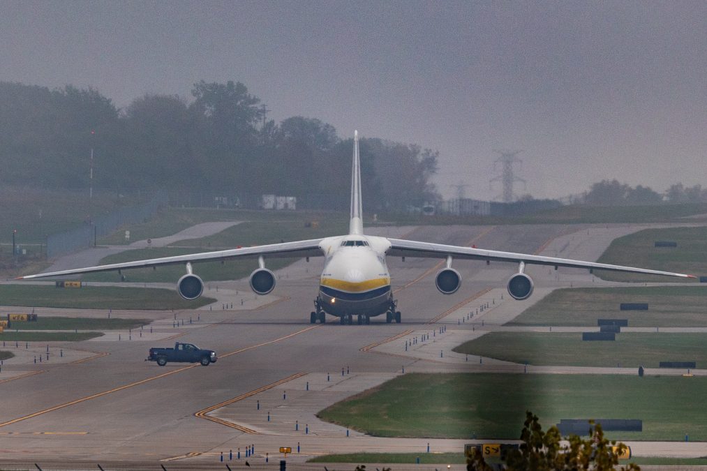 Photo of an Antonov An-124 Ruslan plane taxiing down a runway on a cloudy day