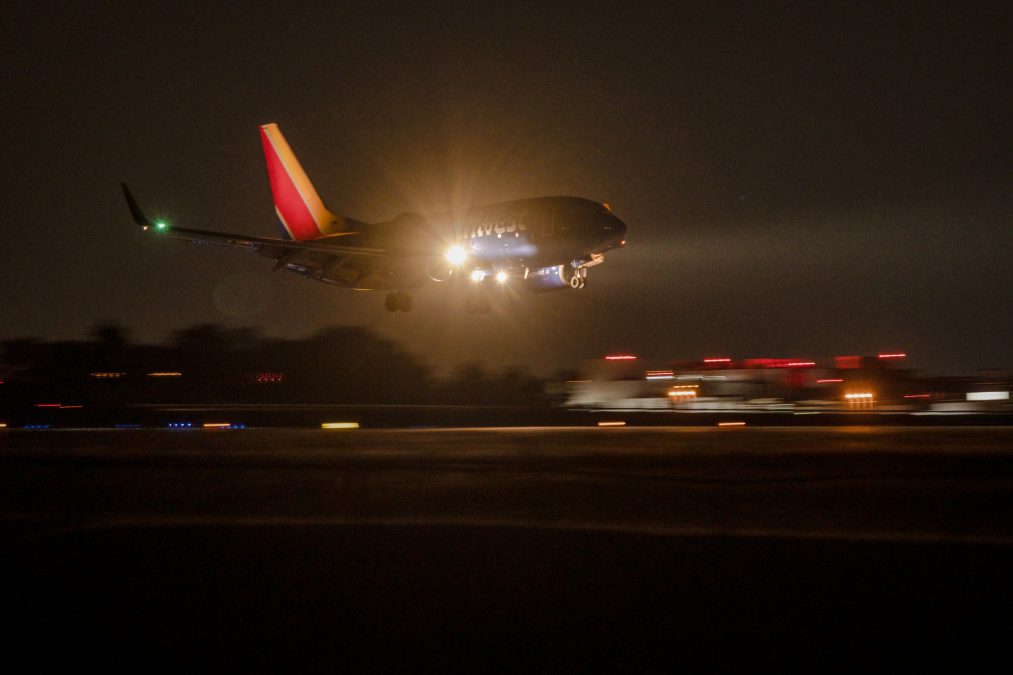 Photo of a Southwest Airlines plane landing at nighttime