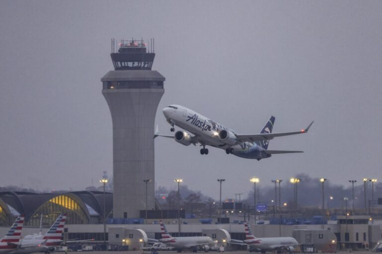 An Alaskan Airlines plane takes off from STL.
