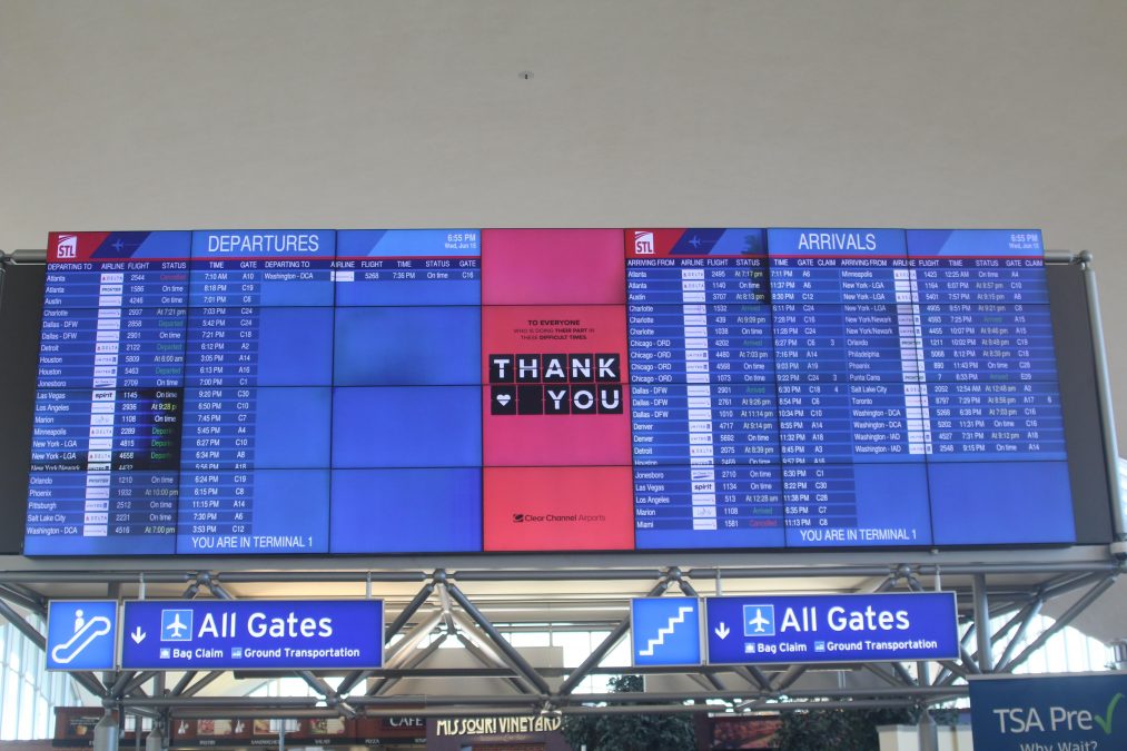 Photo of an airport arrival and departure board, with the words "Thank You" in the middle.