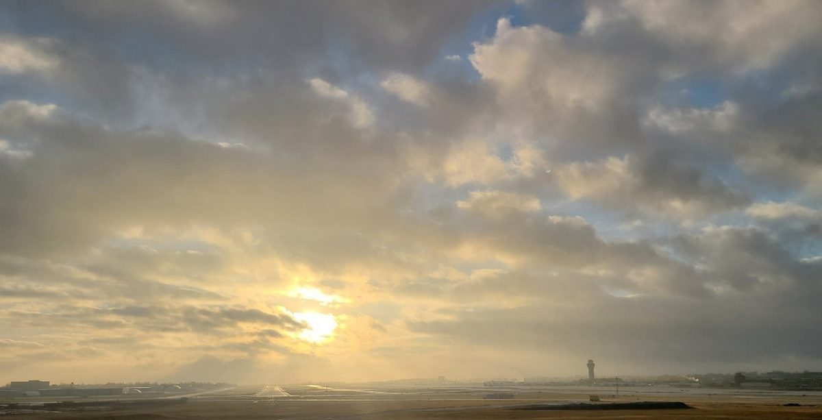 A beautiful sunrise with a bright sky over STL airfield.