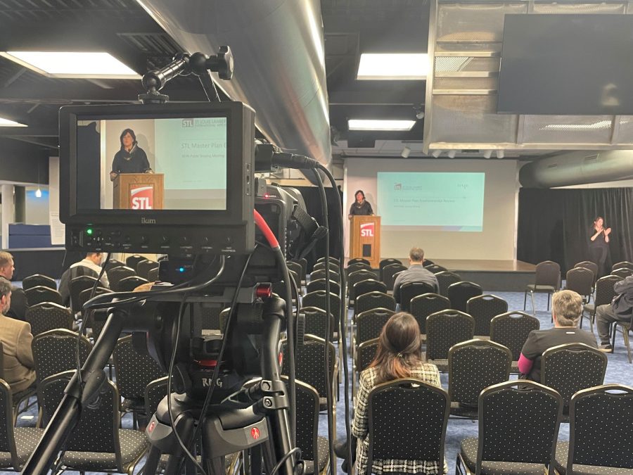 STL airport director is shown on camera in front of the podium at the Scoping Meeting.