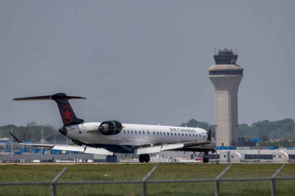 An air canada plane moves on the runway at STL.