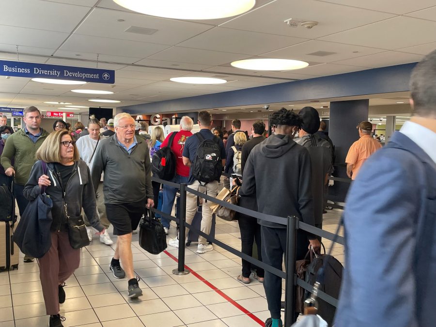 Happy passengers move through the TSA security lines.