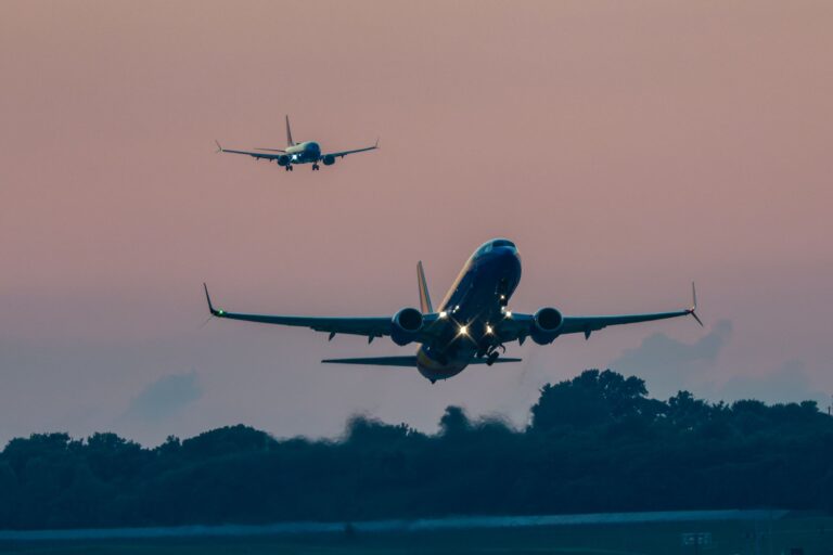 Just another buSTLing evening at STL as one plane lands while another takes off, creating a dance in the sky.