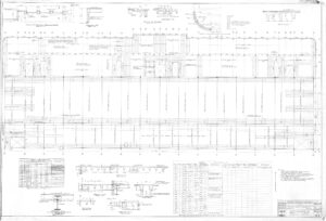 Detailed architectural blueprint showing elevations, sections, reference tables, structural components, measurements, and construction notes for a building façade. Various diagrams and technical data are included.