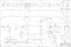 Architectural blueprint showing detailed structural drawings, sections, elevations, and notations of a building’s stage area, including measurements, construction methods, and material specifications.