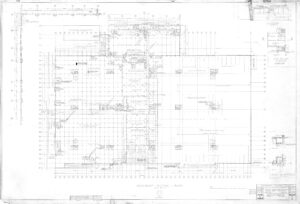 Faint, detailed architectural blueprint labeled “Basement Floor Plan” showing various rooms, walls, columns, measurements, and notes across a large building layout with grids, legends, and scaled drawings.