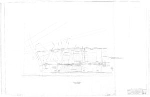 Faint architectural site plan showing building outlines, property lines, measurements, and labeled features such as driveways and utility lines on a white background. Drawing includes handwritten notes and a title block in the lower right corner.