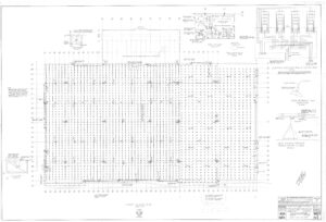 Blueprint of a building’s first floor structural plan, showing a grid of columns, beams, walls, notes, symbols, construction details, and diagrams for footings and reinforcements. Title blocks and annotations appear along the edges.