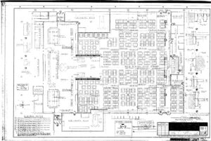 Blueprint of a large building layout showing labeled rooms, entrances, halls, restrooms, offices, and various sections filled with rows of tables. The titled area is “Assembly Building, War Relocation Authority.”.