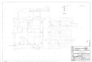 Architectural floor plan blueprint for a building, showing detailed room layouts, walls, doors, windows, and electrical or structural annotations. Title block in the bottom right corner includes project details and scale.