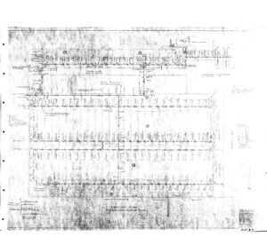 Faded black and white engineering drawing or map with labeled blocks, streets, and lot numbers arranged in a grid layout; text and lines are partially obscured. Three-hole punch marks are visible along the left edge.