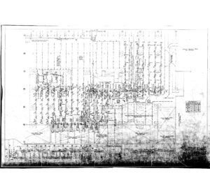 Faint, black-and-white scanned blueprint showing a detailed layout of a parking lot with rows of parking spaces, drive aisles, landscaping areas, notations, and a small site map key in the lower right corner.