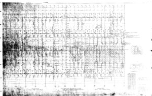 A scanned, faintly printed grid map with street names, lot numbers, and handwritten notes. The map includes a legend, compass rose, and shaded areas indicating specific zones or properties. Some parts are faded or hard to read.