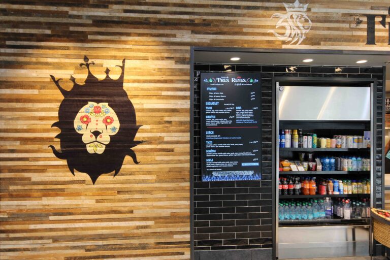 Photo of the beverage display and wall logo at the Casa de Tres Reyes location jn Concourse E in Terminal 2 at STL.
