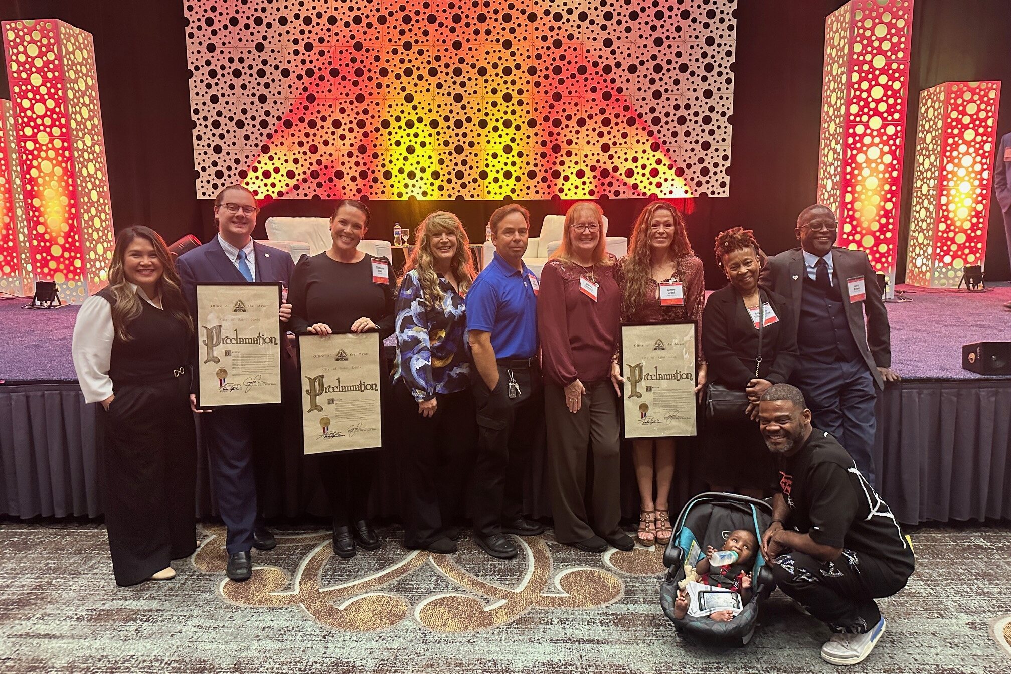 This picture is a photo of the St. Louis Lambert International Airport employees who were named Explore St. Louis Hospitality Heroes and Super Heroes.