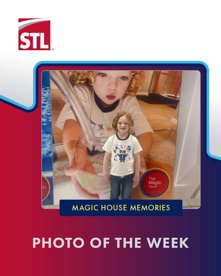 This photo shows five-year-old Levi Brunk posing in front of an ad for the Magic House in St. Louis. The ad shows a three-year-old Levi.