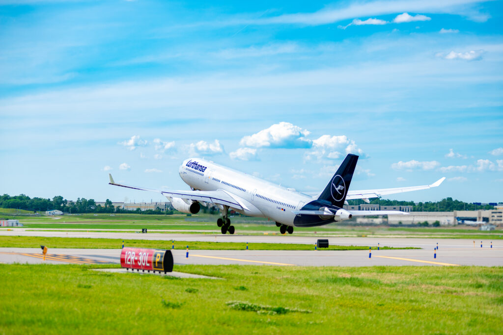 This photo shows a Lufthansa Airlines' Airbus A330-300 taking off to the west from St. Louis Lambert International Airport on Runway 12R-30L, With wheels up the plane is only seconds into its flight.